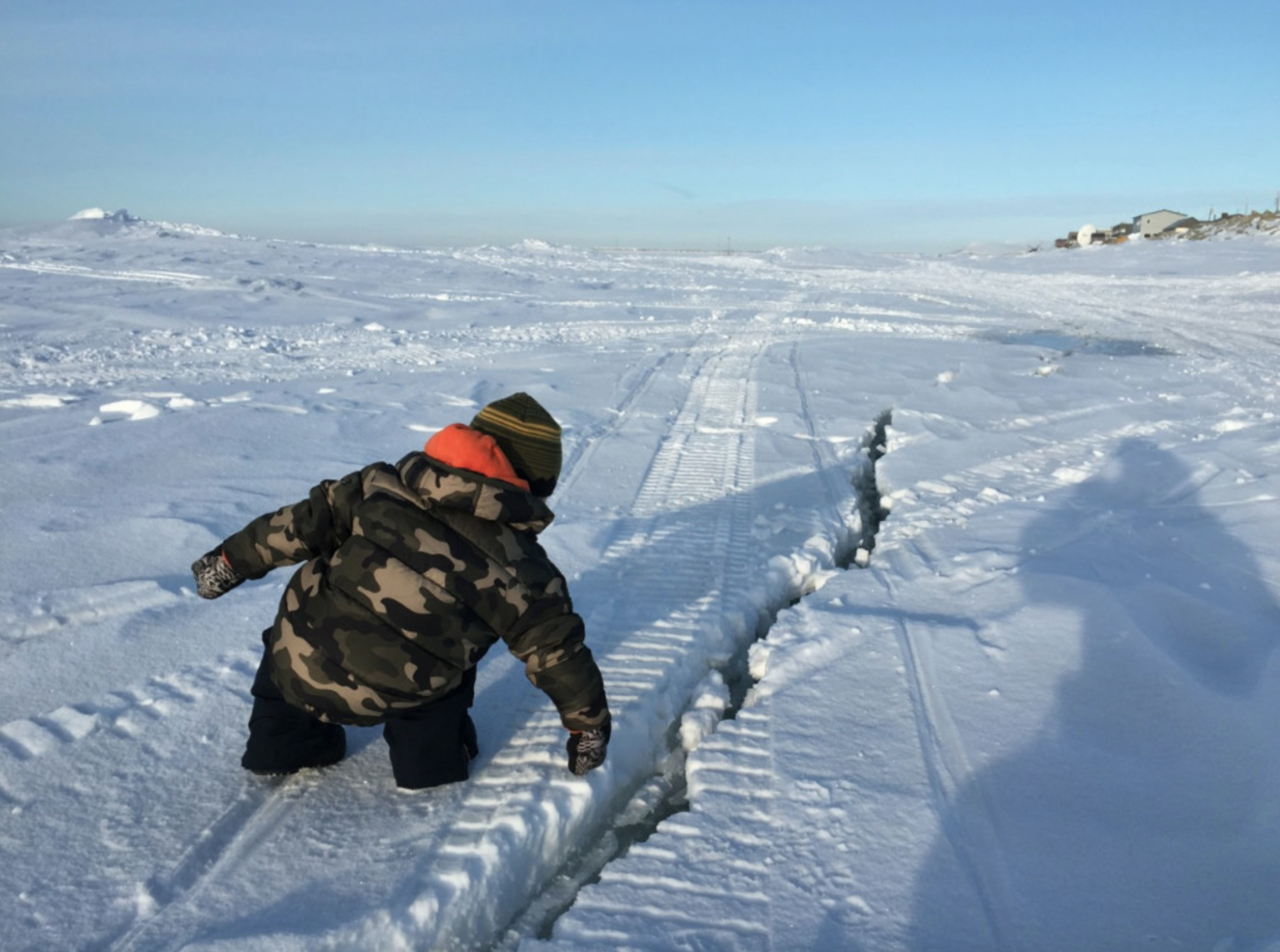 Checking out a crack in the sea ice.